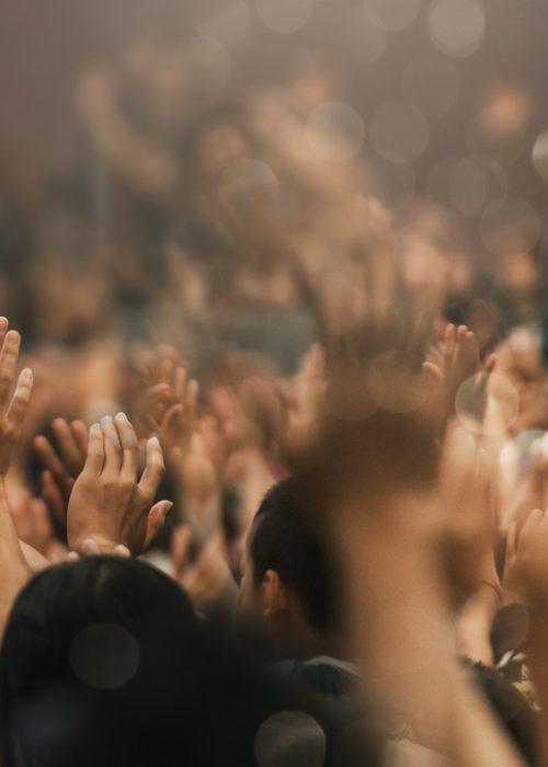 Christian worship with praise to God Ready to raise your hand at the Christian music concert