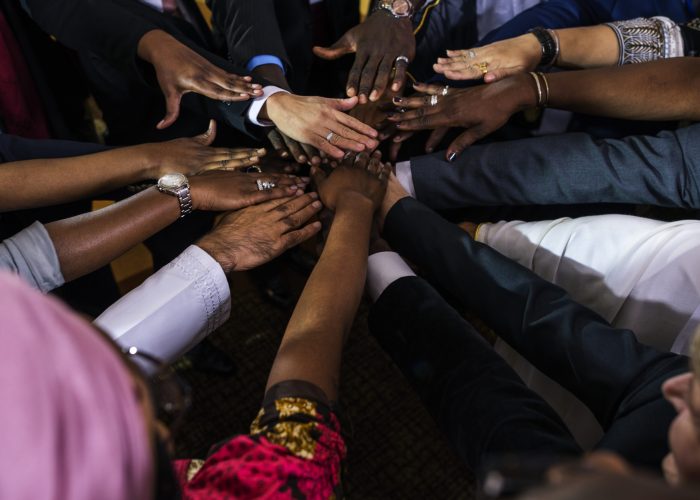 A Group of International Business People Are Putting Their Hands Together